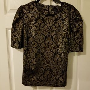 Gorgeous black & gold blouse. Made with a medium .